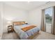 Cozy bedroom with a comfortable bed, side tables, neutral color palette, and natural light from the window at 7834 Hillway Dr, Camby, IN 46113