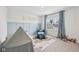 Blue themed bedroom with lots of toys and a window at 7834 Hillway Dr, Camby, IN 46113