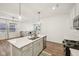 Kitchen with quartz countertops, white cabinets, stainless steel appliances, and an island with bar seating at 7834 Hillway Dr, Camby, IN 46113
