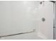 Modern white tiled shower with a glass door and brushed metal fixtures at 7834 Hillway Dr, Camby, IN 46113