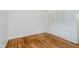 This bedroom boasts pristine white walls, light hardwood floors, and a spacious closet for organized storage at 8022 Hoover Ln, Indianapolis, IN 46260