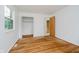 Comfortable bedroom featuring hardwood floors, neutral walls, and a closet at 8022 Hoover Ln, Indianapolis, IN 46260