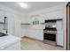 Bright kitchen featuring white cabinetry and stainless steel appliances at 8022 Hoover Ln, Indianapolis, IN 46260