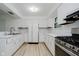 Bright kitchen with white cabinets, stainless appliances, and modern countertops at 8022 Hoover Ln, Indianapolis, IN 46260