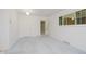 Bright living room with soft carpet, white walls, and natural light at 8022 Hoover Ln, Indianapolis, IN 46260