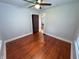 Comfortable bedroom featuring hardwood floors, neutral walls, and one window, creating a bright and inviting space at 810 N Bosart Ave, Indianapolis, IN 46201