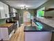 Updated kitchen with white cabinets, stainless steel appliances, and modern lighting at 810 N Bosart Ave, Indianapolis, IN 46201
