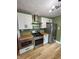 Modern kitchen featuring stainless steel appliances and custom cabinetry at 810 N Bosart Ave, Indianapolis, IN 46201