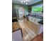 Renovated kitchen featuring an island, modern appliances, and plenty of counter space at 810 N Bosart Ave, Indianapolis, IN 46201