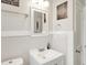 Well-lit bathroom features clean, white fixtures, playful decor, and ample space at 818 Vasbinder Dr, Chesterfield, IN 46017