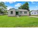 Charming single-story home with a well-manicured lawn and classic siding at 818 Vasbinder Dr, Chesterfield, IN 46017