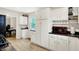 Bright kitchen featuring white cabinets, sleek countertops, and modern appliances at 818 Vasbinder Dr, Chesterfield, IN 46017