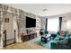 Inviting living room with an entertainment center, plush sofa, and bright accents at 818 Vasbinder Dr, Chesterfield, IN 46017
