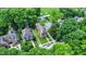 Overhead view of home, green lawns, mature trees, and neighborhood layout at 838 Woodruff Place West Dr, Indianapolis, IN 46201