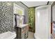 Quirky bathroom featuring unique mosaic tile, a stand-up shower, and an eclectic vanity for storage at 838 Woodruff Place West Dr, Indianapolis, IN 46201