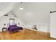 Bright bedroom with wood floors and built-in shelves with a comfortable bed and decor at 838 Woodruff Place West Dr, Indianapolis, IN 46201