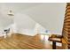 Bright bonus room with hardwood floors, a ceiling fan, and bright white walls at 838 Woodruff Place West Dr, Indianapolis, IN 46201