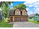 Charming two-story building with a two-car garage and a welcoming exterior paint scheme at 838 Woodruff Place West Dr, Indianapolis, IN 46201