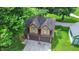 Two car garage with matching trim, nestled beneath mature shade trees at 838 Woodruff Place West Dr, Indianapolis, IN 46201