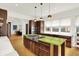 Gourmet kitchen features custom cabinets, a bright green island countertop, and stainless appliances at 838 Woodruff Place West Dr, Indianapolis, IN 46201