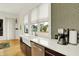 Bright kitchen featuring stainless steel appliances, a farmhouse sink, and lovely countertops at 838 Woodruff Place West Dr, Indianapolis, IN 46201