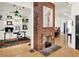 Open-concept living room with fireplace and access to study/office space at 838 Woodruff Place West Dr, Indianapolis, IN 46201