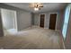 Bedroom with gray walls, neutral carpet, ceiling fan, two closets, and a window at 8433 Fairwind Ct, Indianapolis, IN 46256