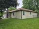 Side view of home with siding and a brick chimney at 8433 Fairwind Ct, Indianapolis, IN 46256