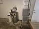 Garage with utility equipment, including a water heater and furnace at 8433 Fairwind Ct, Indianapolis, IN 46256