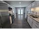 A remodeled kitchen features stainless steel appliances, granite countertops, and white cabinets at 8433 Fairwind Ct, Indianapolis, IN 46256