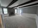 Inviting living room with beamed ceilings, brick fireplace, and natural light at 8433 Fairwind Ct, Indianapolis, IN 46256