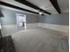 Cozy living room with beamed ceilings, a fireplace and doorway to a kitchen at 8433 Fairwind Ct, Indianapolis, IN 46256