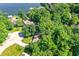 Breathtaking aerial view of lakeside homes nestled among mature trees and lush greenery at 8924 Stormhaven Ct, Indianapolis, IN 46256