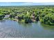 Beautiful aerial view of stunning homes with lake access and docks surrounded by lush trees at 8924 Stormhaven Ct, Indianapolis, IN 46256