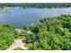 Spectacular aerial view showcasing stunning lakefront homes surrounded by trees and water at 8924 Stormhaven Ct, Indianapolis, IN 46256