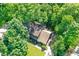 Aerial shot of a home nestled among lush green trees, showcasing its private and secluded location at 8924 Stormhaven Ct, Indianapolis, IN 46256
