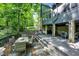 Backyard patio has outdoor dining and living space with stone pillars at 8924 Stormhaven Ct, Indianapolis, IN 46256