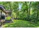 Idyllic backyard featuring mature trees, lush landscaping, and a serene outdoor living space at 8924 Stormhaven Ct, Indianapolis, IN 46256