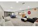 Spacious finished basement featuring a fireplace, ping pong table, and lounge area at 8924 Stormhaven Ct, Indianapolis, IN 46256