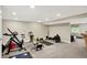 Basement gym area featuring various exercise equipment and ample open space at 8924 Stormhaven Ct, Indianapolis, IN 46256