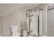 Bathroom featuring a walk-in shower, toilet, and modern fixtures at 8924 Stormhaven Ct, Indianapolis, IN 46256