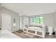 Spacious bathroom featuring a walk-in shower and a large soaking tub surrounded by windows at 8924 Stormhaven Ct, Indianapolis, IN 46256
