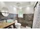 Modern bathroom featuring a glass bowl sink, granite countertops, and tiled walls at 8924 Stormhaven Ct, Indianapolis, IN 46256