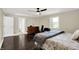 Spacious primary bedroom with large bed, hardwood floors, and a walk-in closet at 8924 Stormhaven Ct, Indianapolis, IN 46256