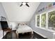 Cozy bedroom with hardwood floors and natural light coming in from the large window at 8924 Stormhaven Ct, Indianapolis, IN 46256