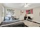 Bedroom featuring lots of photos on the wall, a ceiling fan, and large bed at 8924 Stormhaven Ct, Indianapolis, IN 46256
