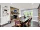 Bright dining room featuring a stone fireplace and built-in shelving at 8924 Stormhaven Ct, Indianapolis, IN 46256