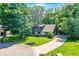 Charming home with stone accents, manicured lawn, and mature trees providing ample shade and curb appeal at 8924 Stormhaven Ct, Indianapolis, IN 46256