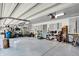 Large garage with storage cabinets, work bench, and organized tools at 8924 Stormhaven Ct, Indianapolis, IN 46256