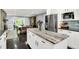 Open concept kitchen with stainless steel appliances and white cabinets at 8924 Stormhaven Ct, Indianapolis, IN 46256